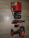 Milwaukee Impact Wrench & Ratchet Set, Li-ion, 18v/12v, 2 Batteries, Red/black. Fixed Price $320.00.